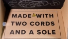 ボックス内のコピー「MADE WITH TWO CORDS ANND A SOLE」
